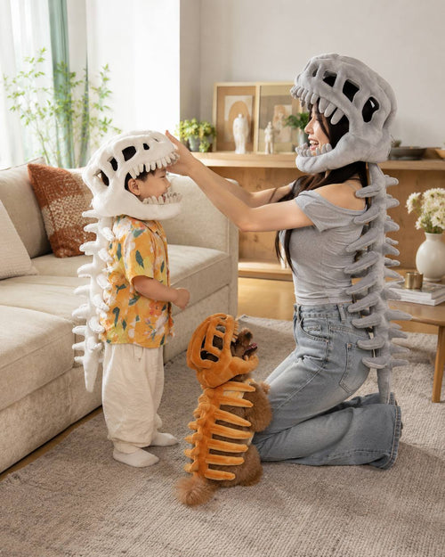 A family wearing Little Roar dinosaur plush costumes
